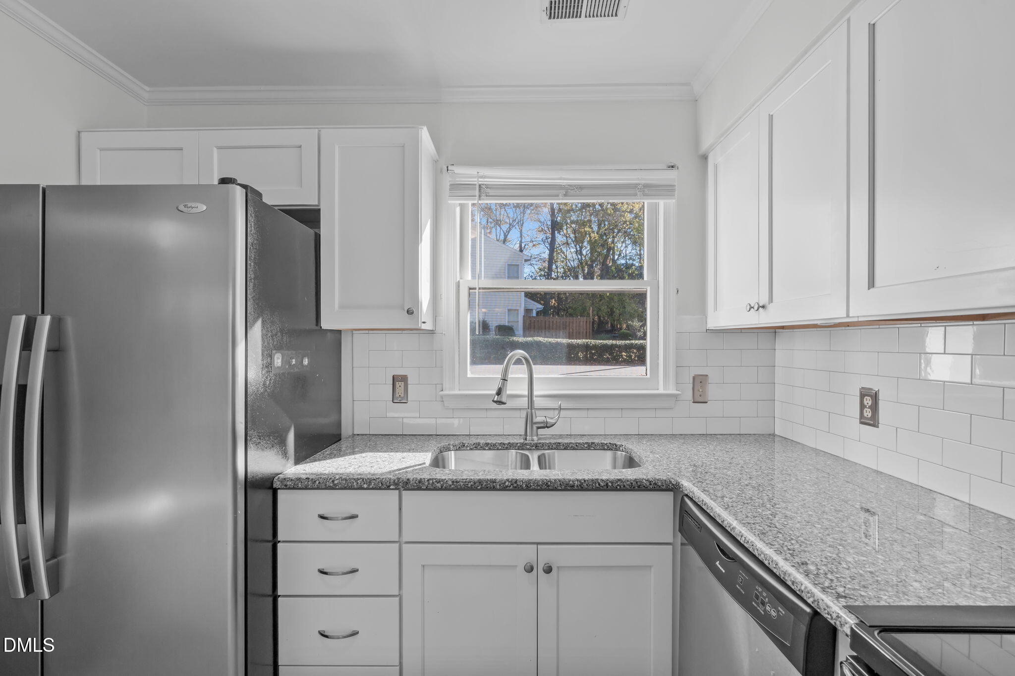 4367 Bona Court Raleigh, NC 27604 - Photo 8 of 28 a kitchen with stainless steel appliances granite countertop a sink stove and refrigerator