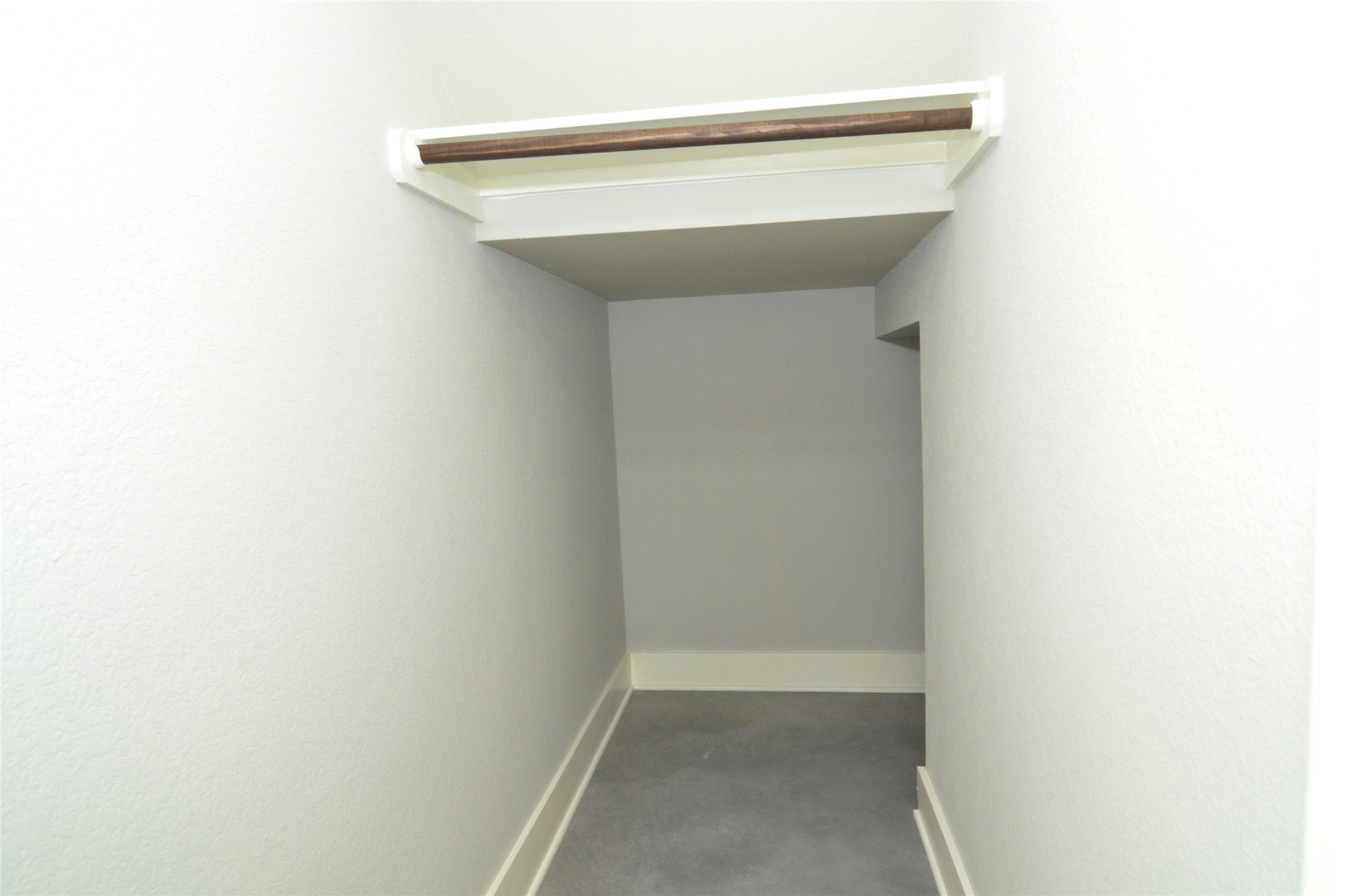 1916 Cleese Drive Austin, TX 78741 - Photo 13 of 36 A well-lit closet with a hanging rod provides practical storage solutions.