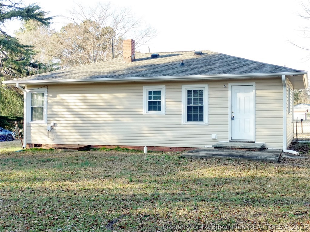 5309 Cypress Road Fayetteville, NC 28304 - Photo 3 of 15 a front view of a house with a yard