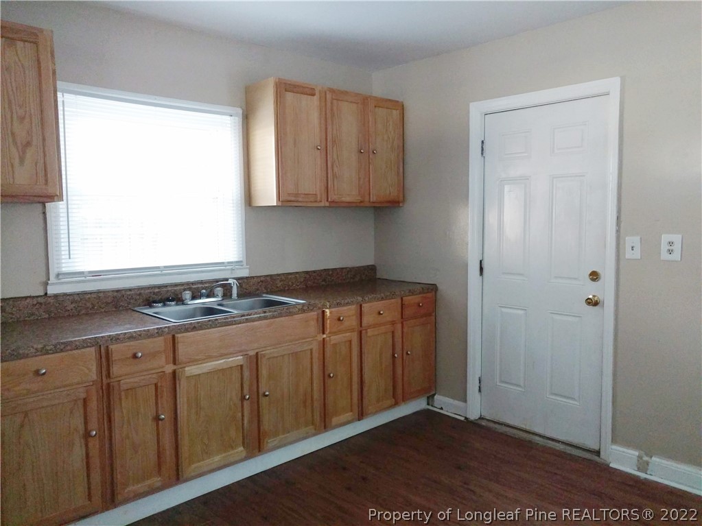 5309 Cypress Road Fayetteville, NC 28304 - Photo 5 of 15 a kitchen with a sink cabinets and a window