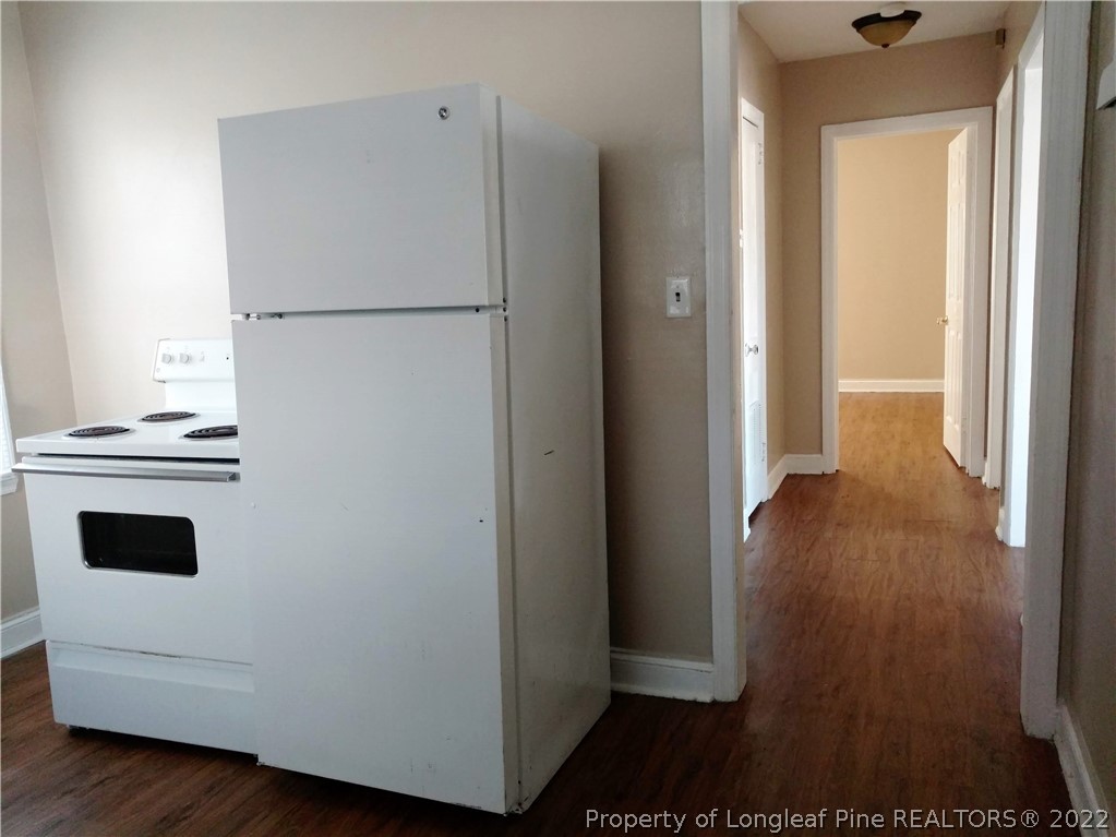 5309 Cypress Road Fayetteville, NC 28304 - Photo 6 of 15 a view of kitchen and wooden floor