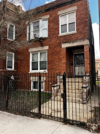 a view of a brick building and large windows