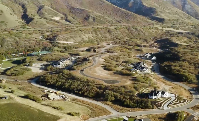 89 East Mapleton Estates Drive, Unit 99102 Mapleton, UT 84664 - Photo 5 of 8 Expansive aerial showcasing multiple new construction homes and vacant lots nestled within a mountainous landscape