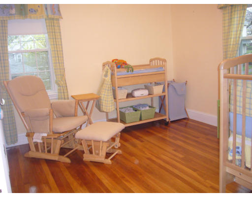 31 Waldeck Road Milton, MA 02186 - Photo 13 of 18 a living room with furniture a flat screen tv and next to a window