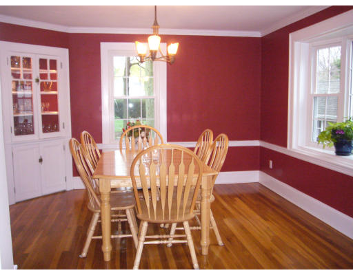 31 Waldeck Road Milton, MA 02186 - Photo 5 of 18 a view of a dining room with furniture a chandelier and wooden floor