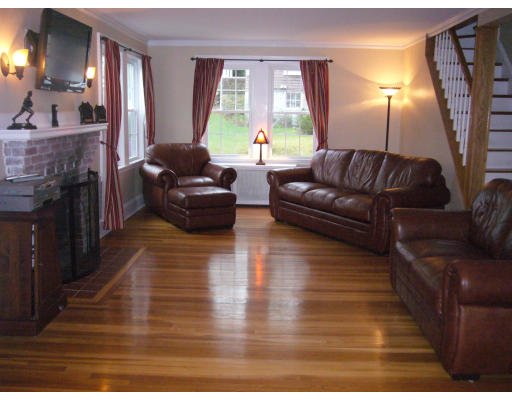 31 Waldeck Road Milton, MA 02186 - Photo 8 of 18 a living room with furniture and a fireplace
