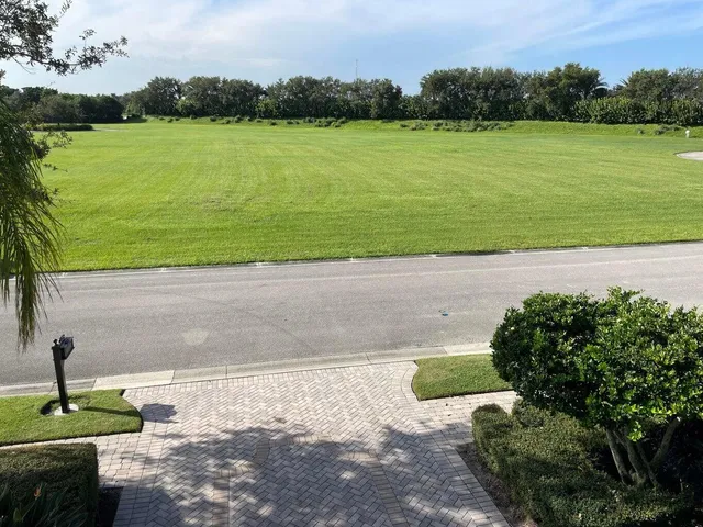 a view of a lake with a yard