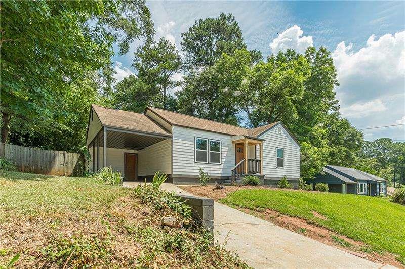 2276 Hillside Avenue Decatur, GA 30032 - Photo 1 of 1 a front view of house with yard and trees around
