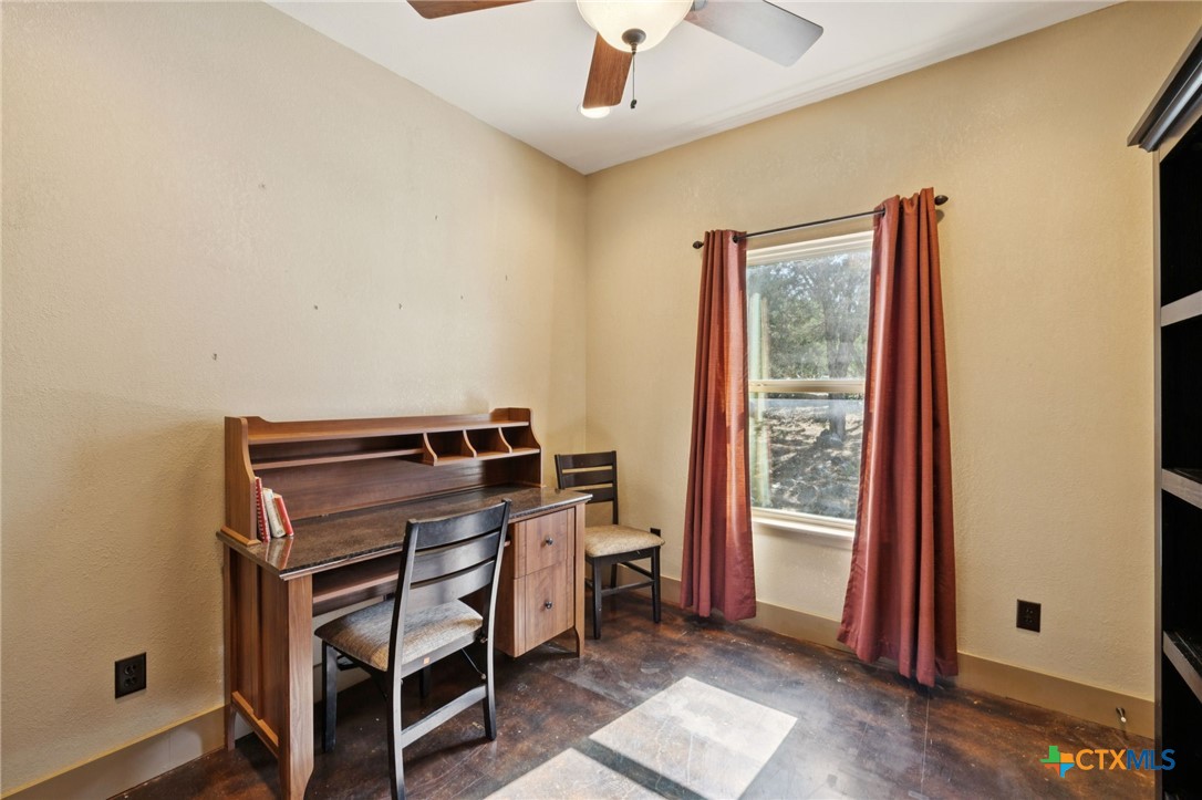 1331 Hilltop Ridge New Braunfels, TX 78132 - Photo 14 of 29 a living room with a piano and a window