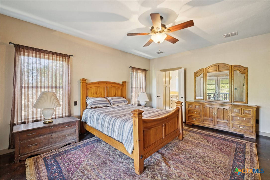 1331 Hilltop Ridge New Braunfels, TX 78132 - Photo 16 of 29 a bedroom with a bed and window