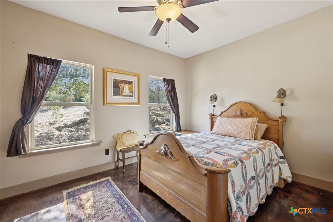 1331 Hilltop Ridge New Braunfels, TX 78132 - Photo 19 of 29 a bedroom with bed and a window