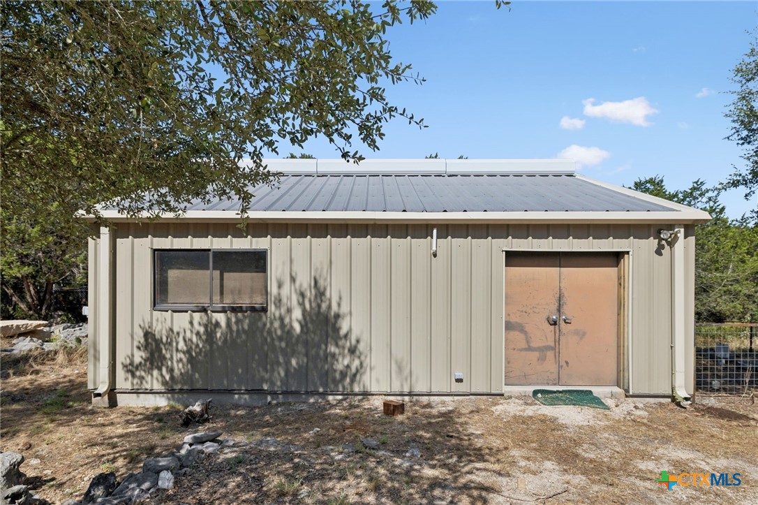 1331 Hilltop Ridge New Braunfels, TX 78132 - Photo 24 of 29 a view of a house with a yard