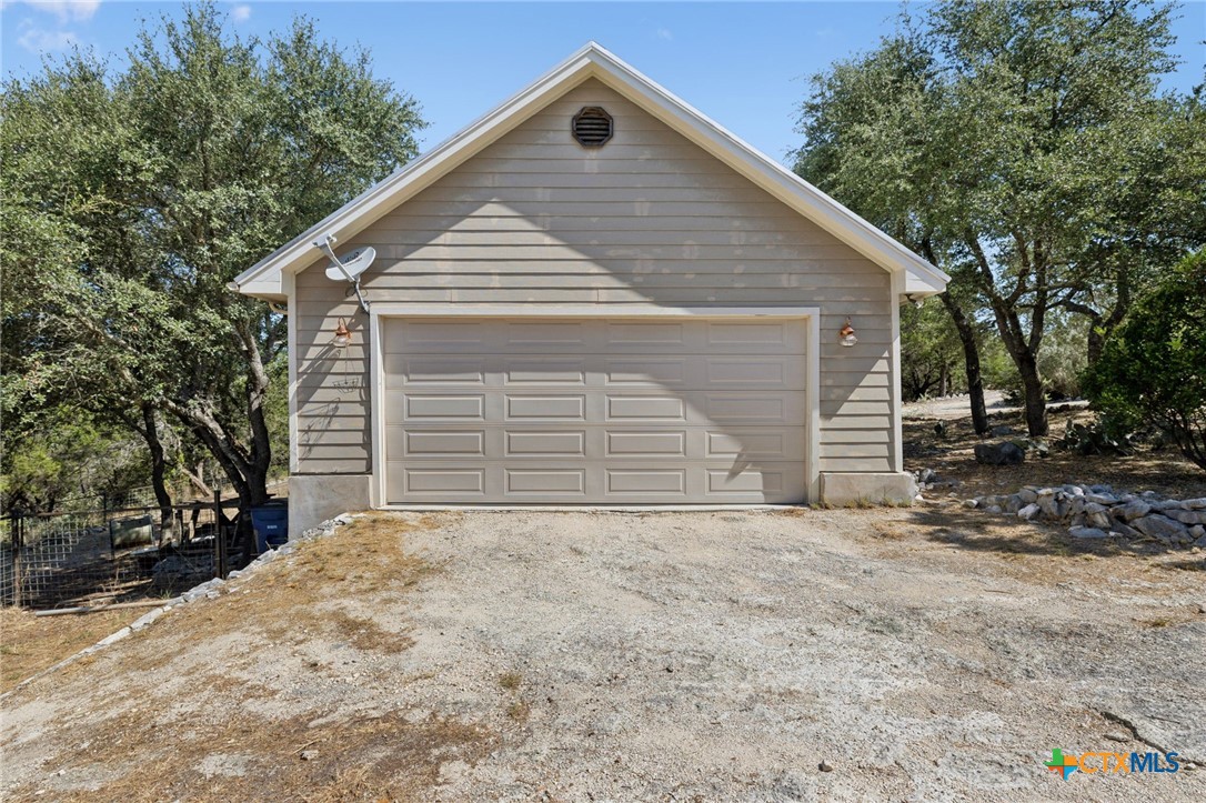 1331 Hilltop Ridge New Braunfels, TX 78132 - Photo 26 of 29 a front view of house with yard and trees