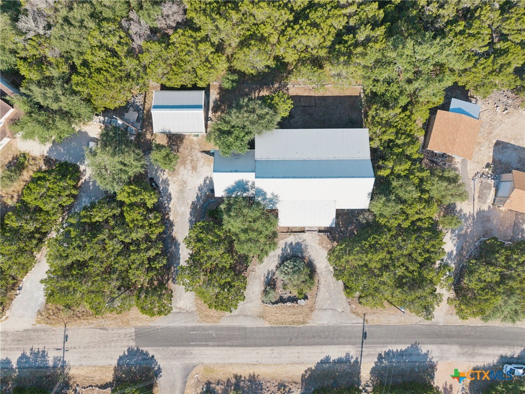 1331 Hilltop Ridge New Braunfels, TX 78132 - Photo 29 of 29 an aerial view of a house with trees