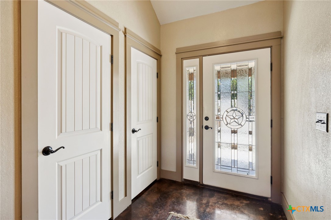 1331 Hilltop Ridge New Braunfels, TX 78132 - Photo 3 of 29 a view of front door with wooden floor