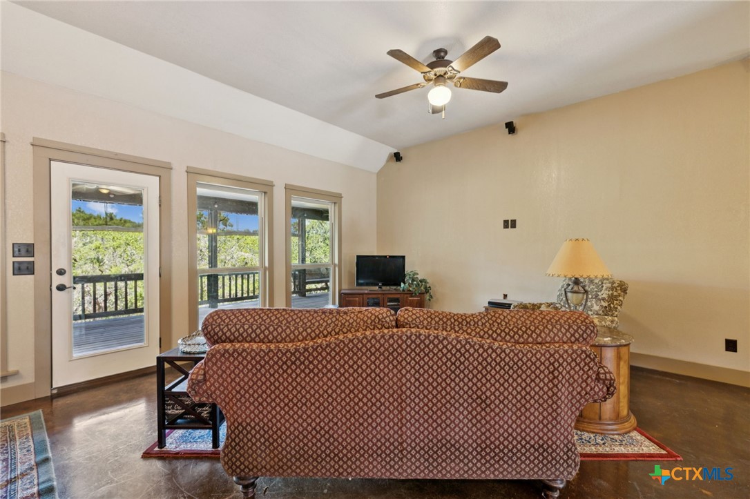 1331 Hilltop Ridge New Braunfels, TX 78132 - Photo 5 of 29 a bedroom with a large bed and a window