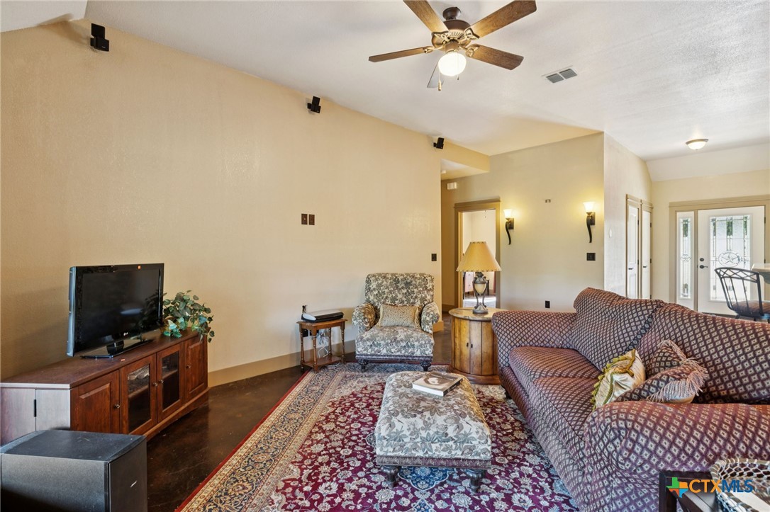1331 Hilltop Ridge New Braunfels, TX 78132 - Photo 8 of 29 a living room with furniture and a flat screen tv