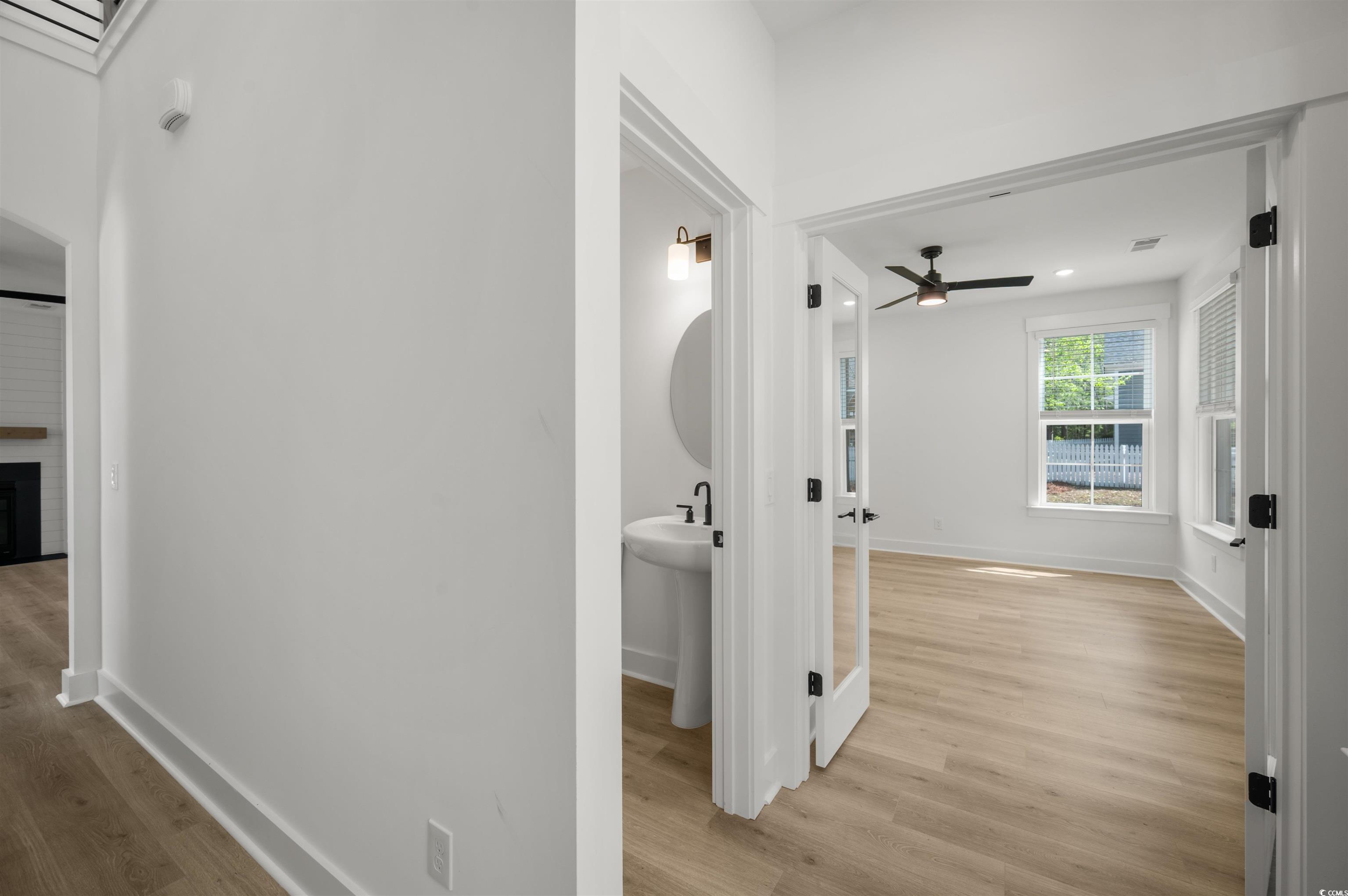 67 Bridge View Road Georgetown, SC 29440 - Photo 13 of 40 Corridor featuring light wood finished floors and recessed lighting