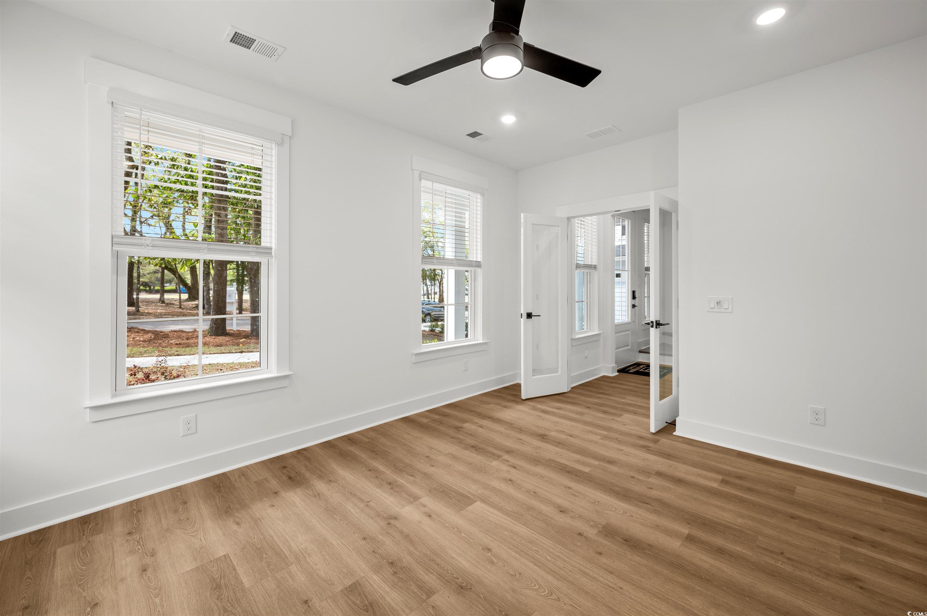 67 Bridge View Road Georgetown, SC 29440 - Photo 14 of 40 Unfurnished room with light wood-type flooring, recessed lighting, and a ceiling fan
