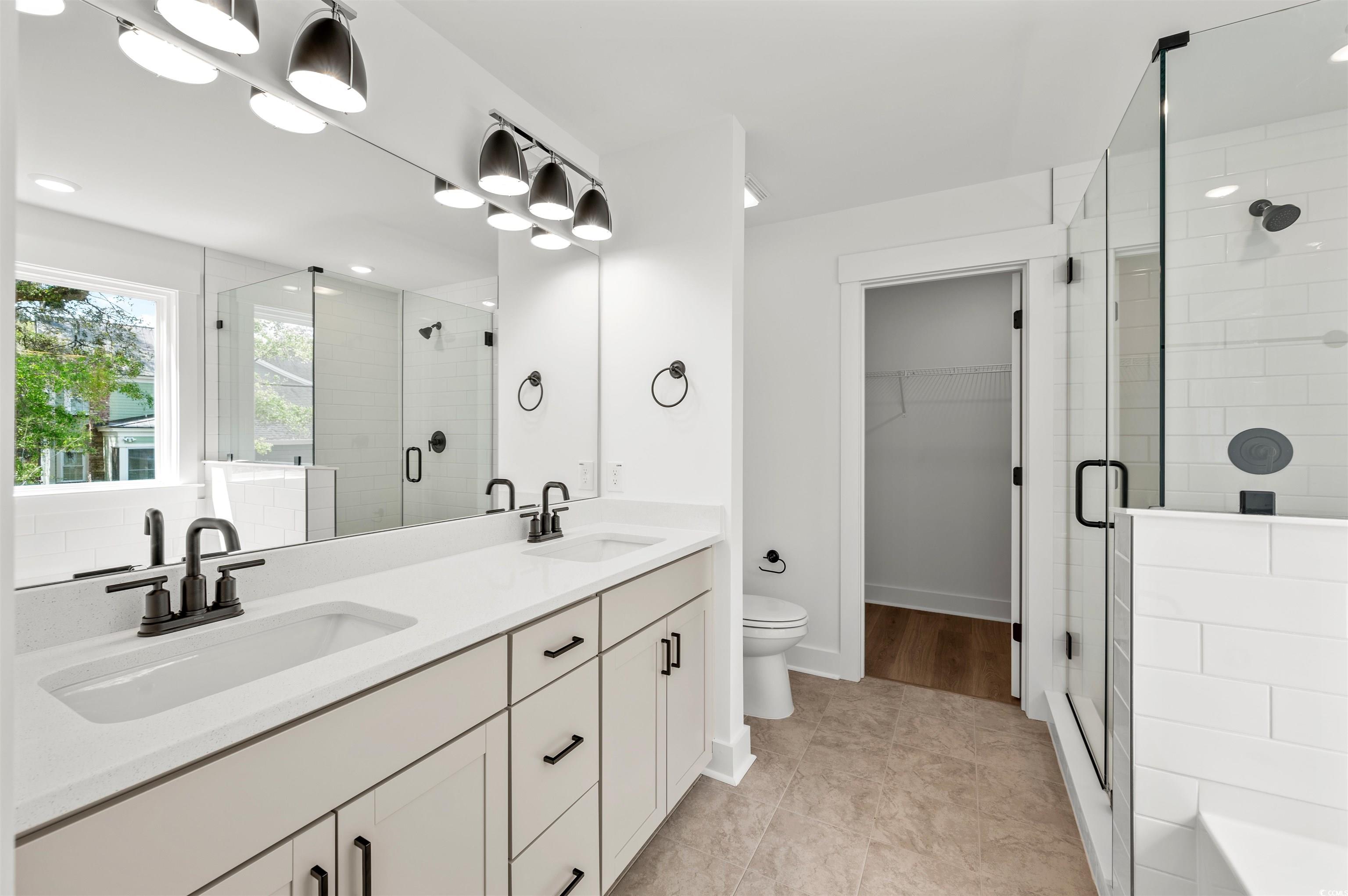 67 Bridge View Road Georgetown, SC 29440 - Photo 20 of 40 Full bath featuring a spacious closet, a stall shower, double vanity, light tile patterned floors, and recessed lighting