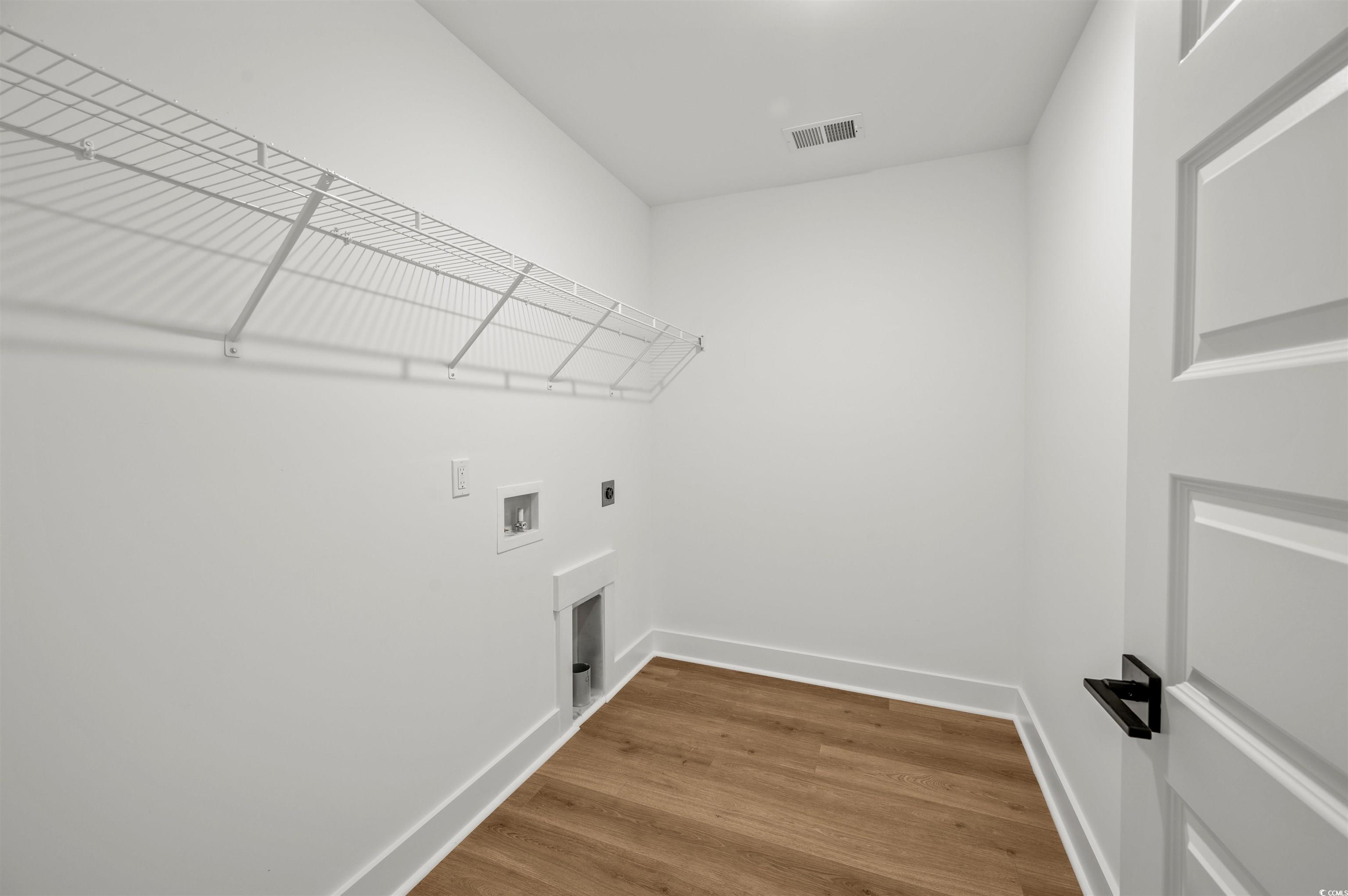 67 Bridge View Road Georgetown, SC 29440 - Photo 24 of 40 Laundry area with wood finished floors, washer hookup, and hookup for an electric dryer