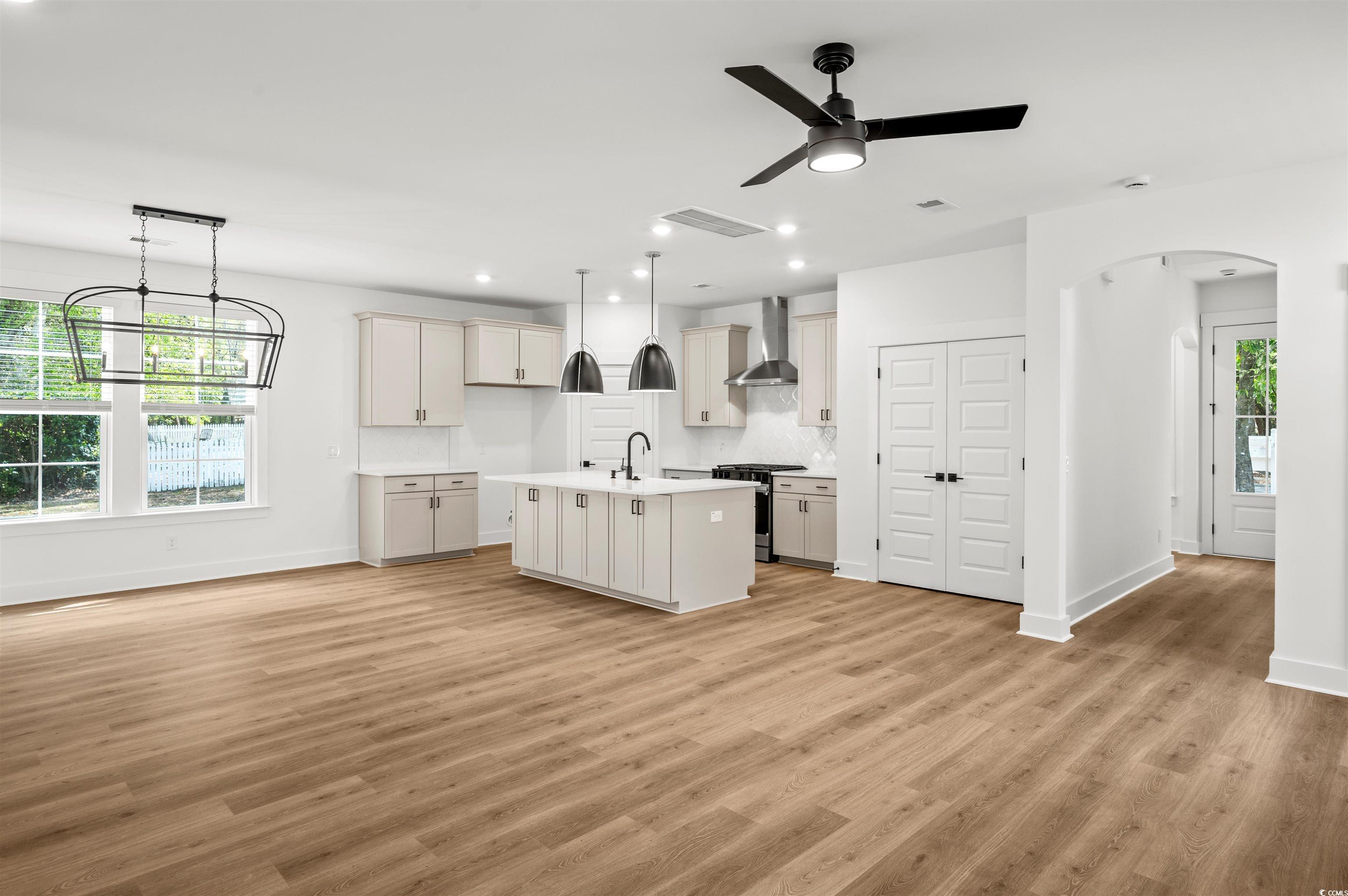 67 Bridge View Road Georgetown, SC 29440 - Photo 4 of 40 Kitchen with hanging light fixtures, gas range, recessed lighting, and light wood finished floors
