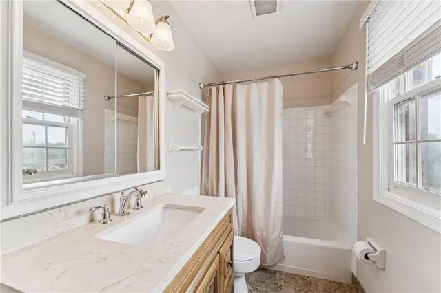 a balcony view with a seating space