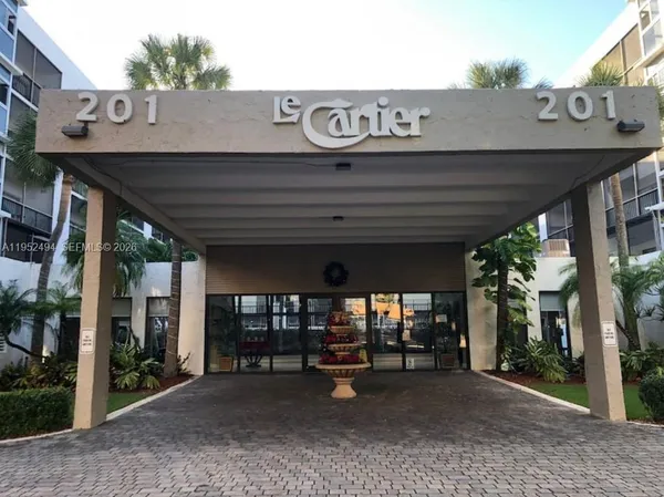 a view of a car park in front of house