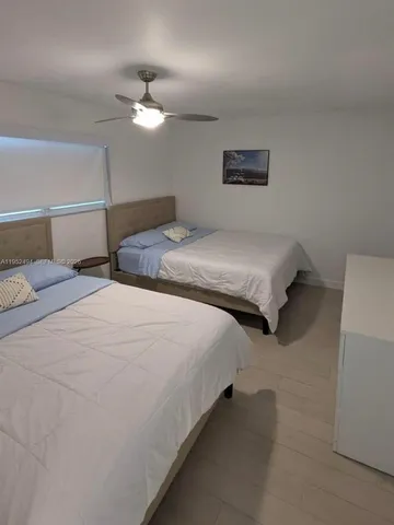 a kitchen with a sink a stove and cabinets
