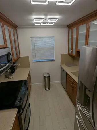 a view of a room with furniture window and wooden floor