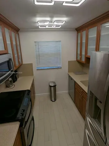 a view of a room with furniture window and wooden floor