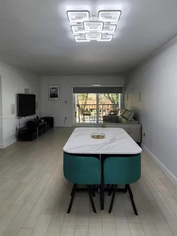 a bathroom with a sink toilet and mirror