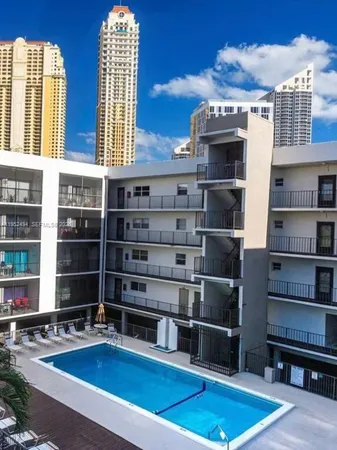 a view of a chairs and table in the balcony