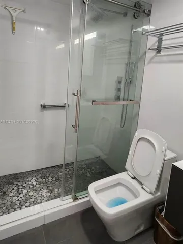 a view of a livingroom with furniture and a rug