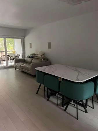 a bedroom with bed and a chandelier