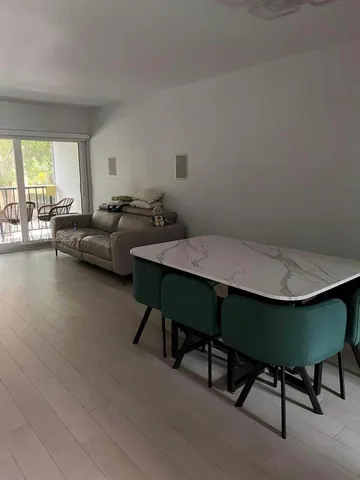 a bedroom with bed and a chandelier