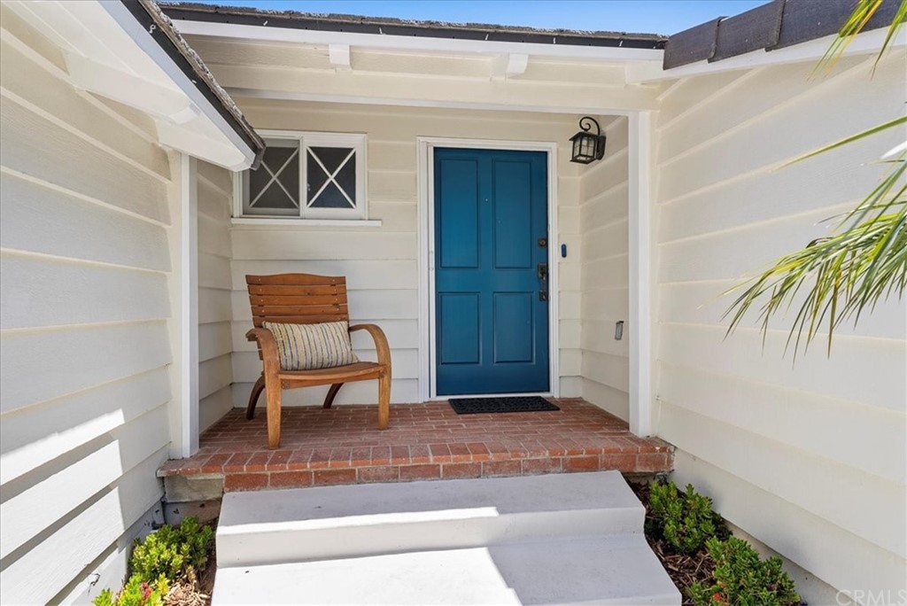 1137 Vía Coronel Palos Verdes Estates, CA 90274 - Photo 2 of 20 a view of a hallway with wooden floor and a potted plant