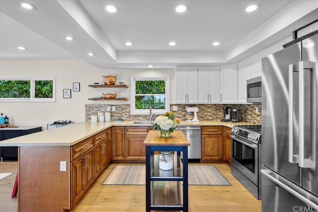 1137 Vía Coronel Palos Verdes Estates, CA 90274 - Photo 7 of 20 a kitchen with stainless steel appliances granite countertop a stove top oven a sink a counter space and cabinets