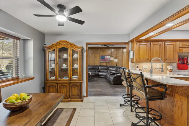a living room with furniture fireplace and flat screen tv