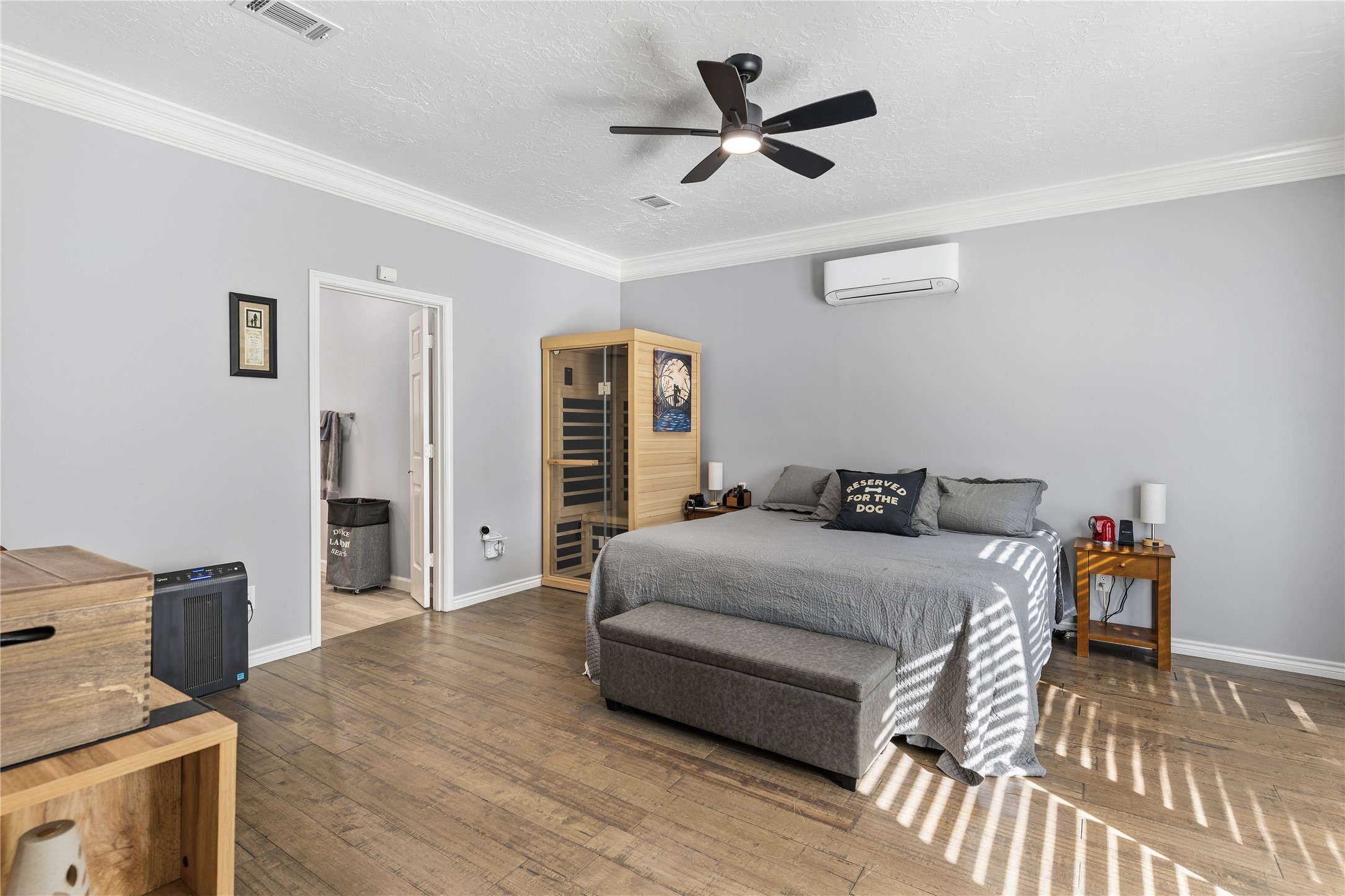 6618 Wimbledon Trail Road Spring, TX 77379 - Photo 23 of 44 a spacious bedroom with a bed a dresser and a chandelier