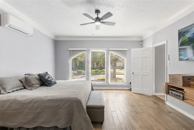 a en suite bathroom with a granite countertop sink and a mirror