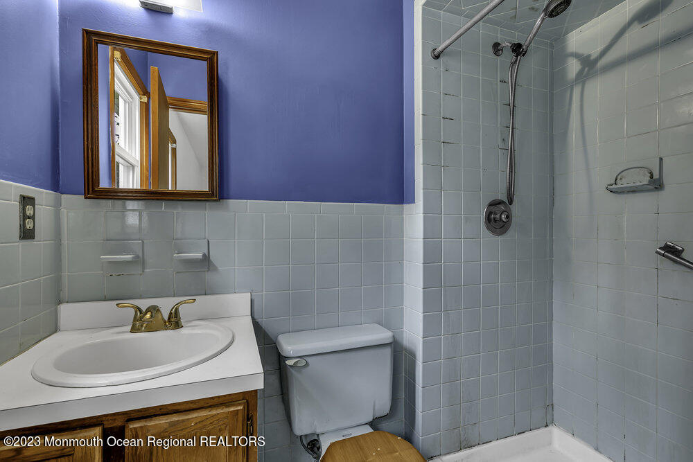 10 Eagle Drive Bayville, NJ 08721 - Photo 12 of 42 a bathroom with a sink a toilet and shower