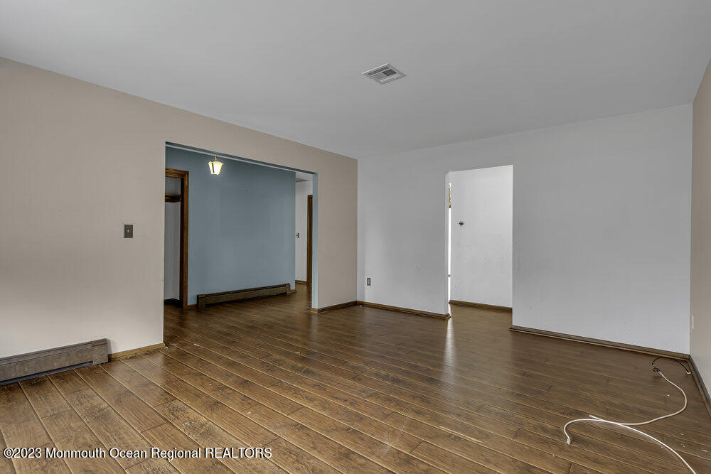 10 Eagle Drive Bayville, NJ 08721 - Photo 18 of 42 an empty room with wooden floor and closet