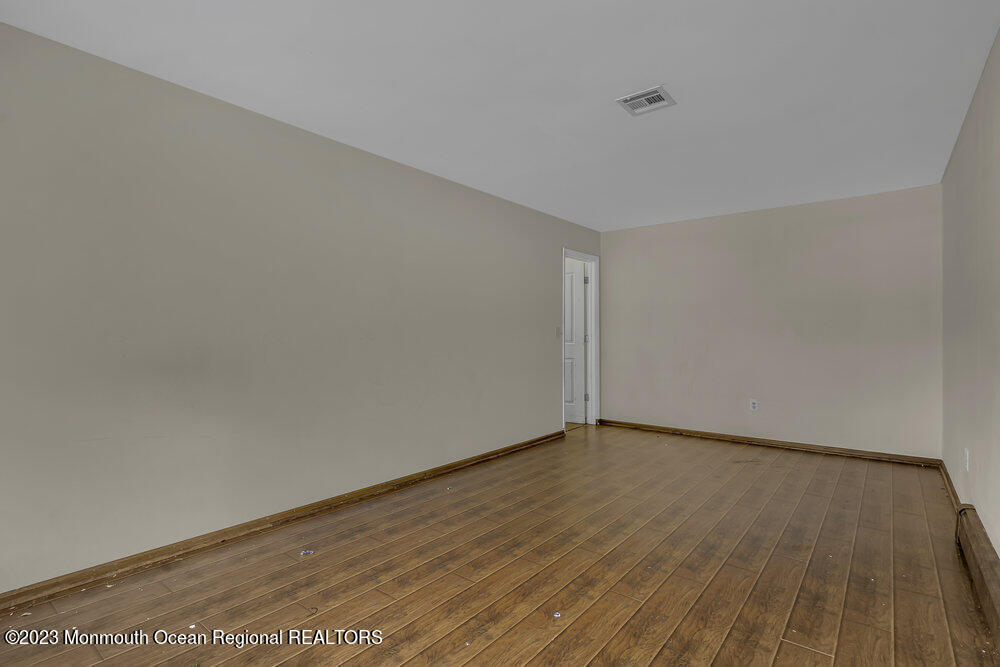 10 Eagle Drive Bayville, NJ 08721 - Photo 21 of 42 a view of an empty room with wooden floor