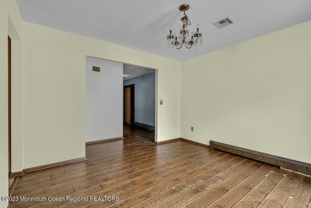 10 Eagle Drive Bayville, NJ 08721 - Photo 23 of 42 a view of an empty room with wooden floor