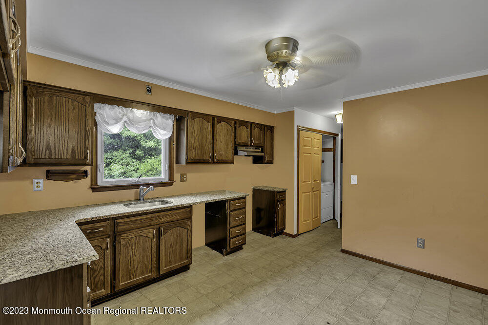 10 Eagle Drive Bayville, NJ 08721 - Photo 24 of 42 a kitchen with stainless steel appliances granite countertop a sink and cabinets