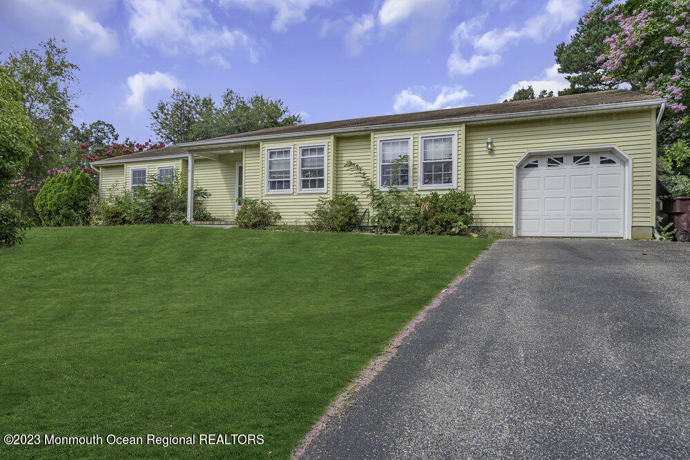 10 Eagle Drive Bayville, NJ 08721 - Photo 3 of 42 a front view of a house with a yard and garage