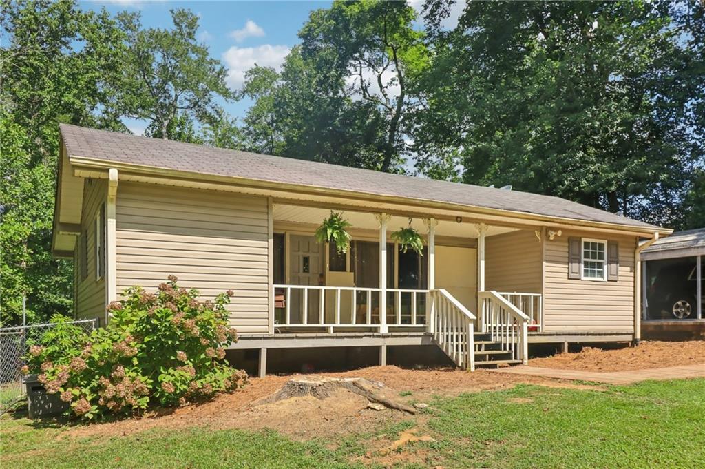 458 Hitchcock Road Dallas, GA 30157 - Photo 1 of 1 a front view of a house with a yard