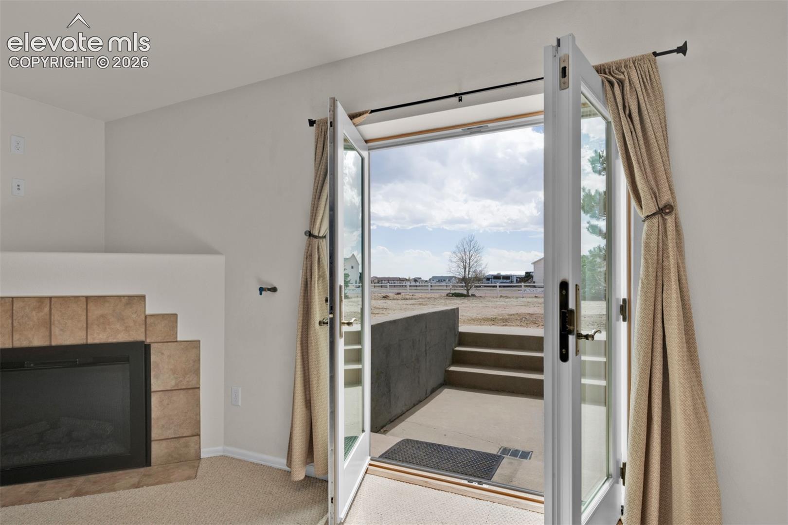 8407 Weiscamp Road Peyton, CO 80831 - Photo 40 of 49 Multi-Family Living Area with Walk-Out to the Back Yard