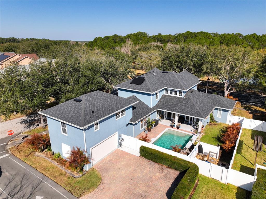 3305 Schoolhouse Road St. Cloud, FL 34773 - Photo 60 of 83 an aerial view of residential houses with outdoor space and trees